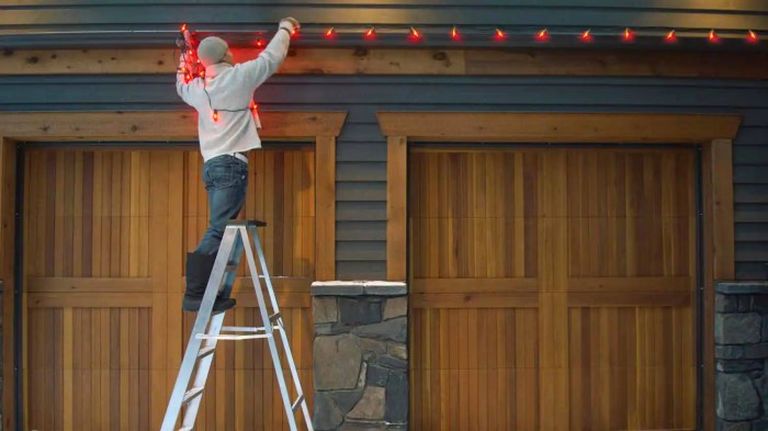 Christmas decor around garage lights